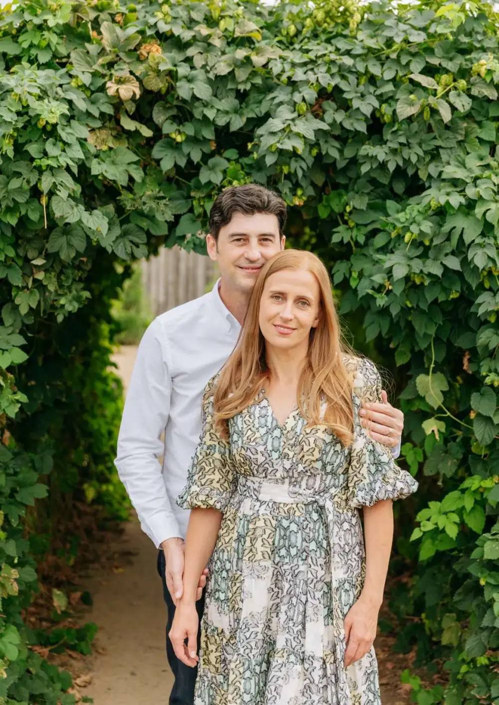 Teofil Ciorba and Lilia, owners of Fairway Home Care, standing in a garden